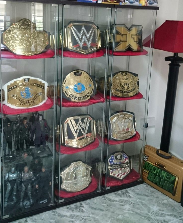 a display case filled with lots of wrestling belts