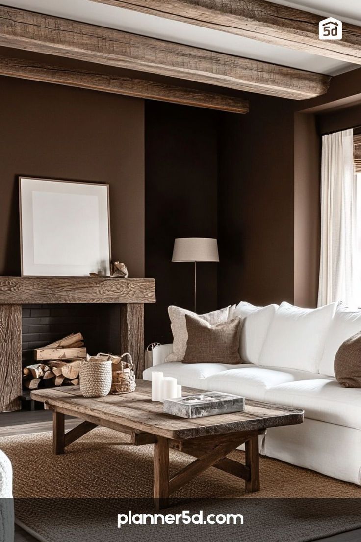 a living room with brown walls and white furniture in the center, along with a fireplace