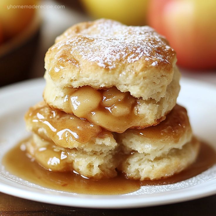 two biscuits stacked on top of each other covered in caramel sauce