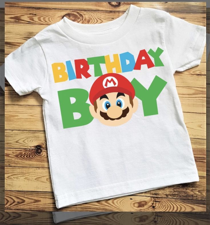 a white shirt with an image of a mario birthday boy on the front and back