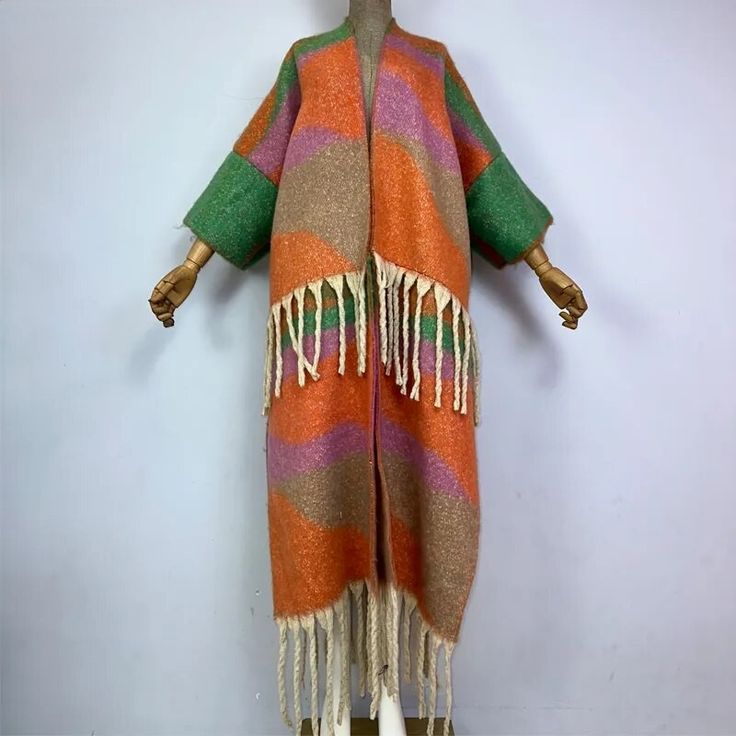 This super soft and warm wool cardigan kimono is perfect for the cold weather. Unlike other sweaters and wools, the wool used for this beauty is non itchy. Think of your favorite throw blanket, the comfort and warmth it gives but 10x stylish and wearable any where. This kimono is all that and more! One size fits S-4X Material: Wool One Size Fits Most Size Chart One Size Acrylic Outerwear For Layering, Long Multicolor Cardigan For Layering, Multicolor Long Cardigan For Layering, Warm Cozy Sweater Coat For Spring, Cozy Warm Sweater Coat For Spring, Cozy Warm Spring Sweater Coat, One Size Long Cardigan For Winter, One Size Long Winter Cardigan, One Size Long Sweater For Fall