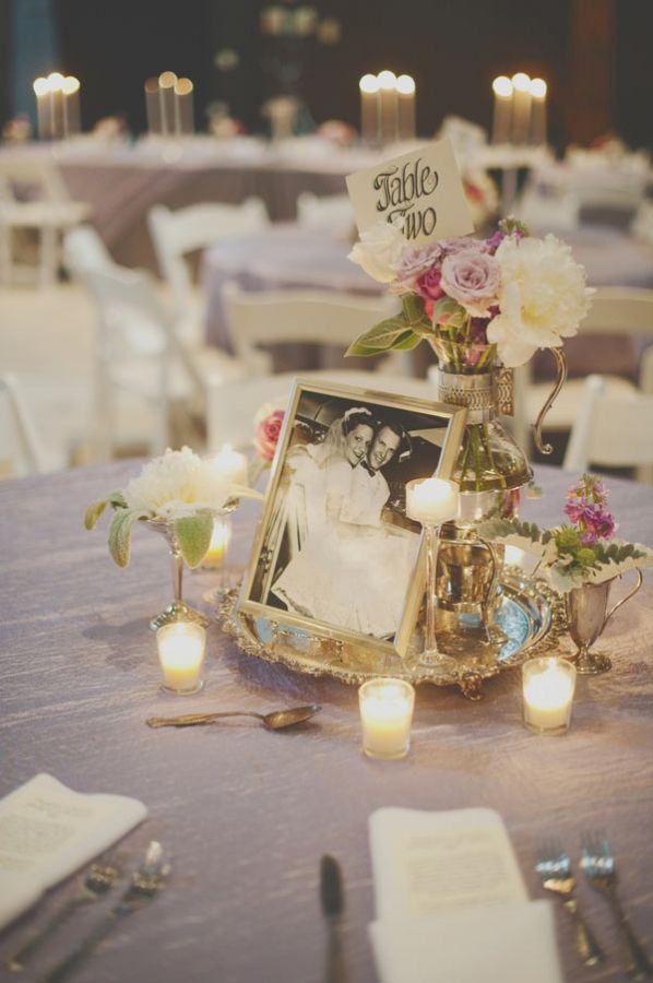 the table is set up with flowers and candles