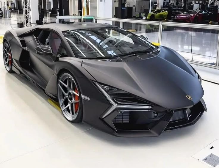 a black sports car parked in a garage