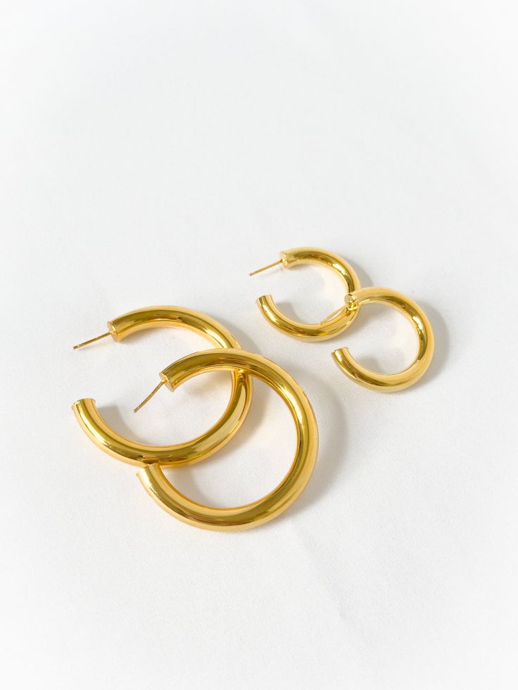 Everyone needs one of these, pairs well with everything and anything. Comes in gold and silver, and in two sizes. Made in Gold Vermeil (18k gold layer on sterling silver) & Sterling Silver Dimensions: small 5mm wide, 22mm inner diameter / large 7mm wide, 45mm inner diameter Timeless Gold Jewelry With Thick Band, Timeless Thick Band Gold Jewelry, Everyday Gold Thick Band Jewelry, Modern Gold Jewelry With Thick Band, Everyday Yellow Gold Jewelry With Shiny Finish, Gold Jewelry Thick Band Gift, Gold Rounded Earrings With Polished Finish, Gold Polished Finish Earrings, Gold Thick Band Jewelry Gift