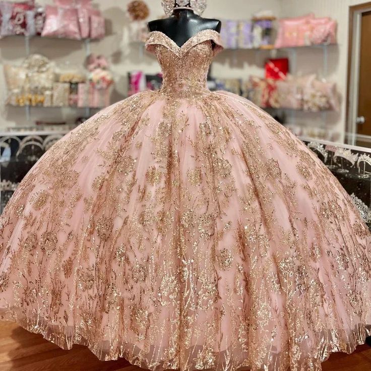 a pink ball gown on display in a store