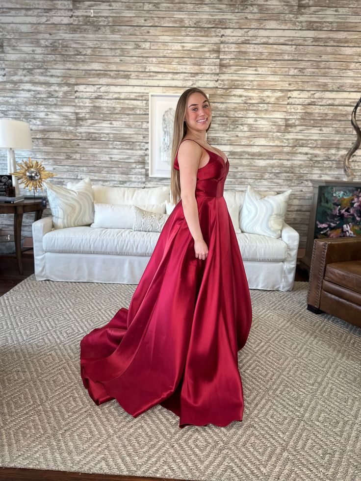 Women's Red Carpet Aline formal gown with straps, side slit and pockets Annika Burgundy Wine Satin Gown Elevate your formal elegance with our Annika Burgundy Wine Satin Gown. Crafted from luxurious satin, it exudes a sophisticated charm with its deep burgundy hue. Its flattering silhouette, coupled with a subtle sheen, creates an effortlessly stylish look for any special occasion. Shop more from our dresses collection, here! Details Available in sizes 6 Color: Burgundy Wine Gorgeous train Formal Elegant Red Satin Finish Evening Dress, Elegant Red Evening Dress With Satin Finish, Red Satin Dress For Prom Season, Red Satin Dress For Prom, Burgundy Satin Dress For Prom Season, Red Satin Dress For Formal Occasions, Satin Evening Dress For Red Carpet And Prom Season, Formal Red Satin Dress, Satin Evening Dress For Prom And Red Carpet