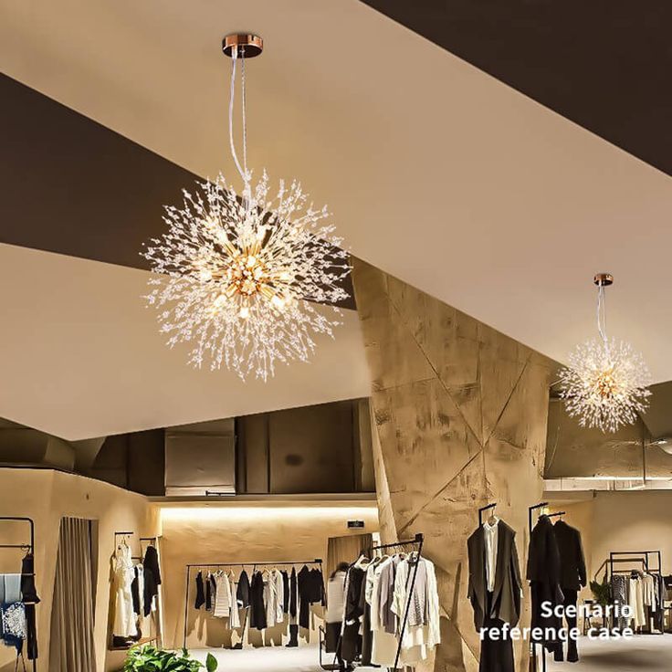 a chandelier hanging from the ceiling in a clothing store