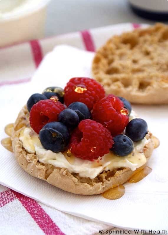 a waffle sandwich with berries and cream on top