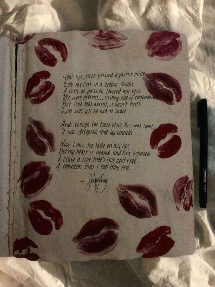 an open book with red lipstick on it