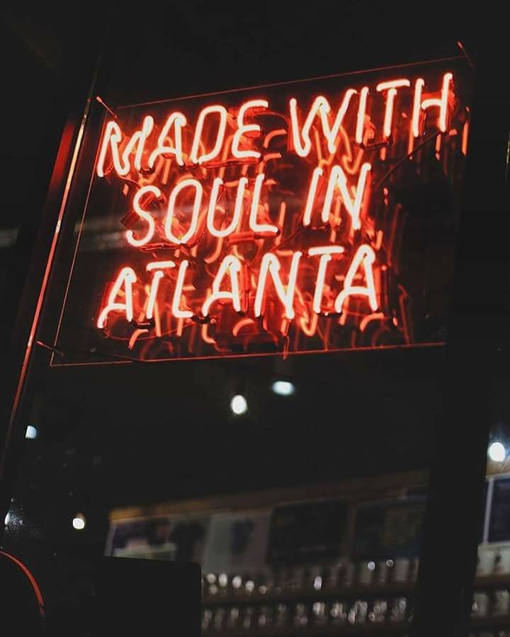 a neon sign that reads made with soul in atlanta