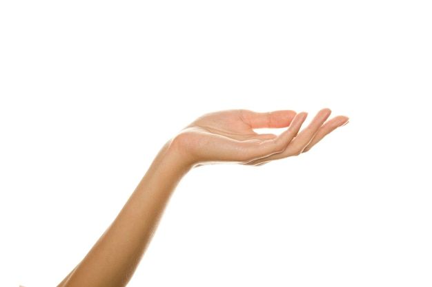 a woman's hand holding something in the air