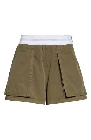 A branded elastic waistband features in tucked-in or cropped-top pairings with these cargo-influenced rave shorts cut from peached cotton twill. 3" inseam; 27" leg opening; 11" front rise; 16" back rise (size 2) Side zip closure Cargo bellows pockets; back flap pockets 100% cotton with 64% nylon, 22% polyester, 14% elastane waistband Dry clean Imported Designer Clothing Rave Shorts, Army Green, Alexander Wang, Cotton Twill, Nordstrom, High Waisted, Crop Tops, Clothes Design, Design