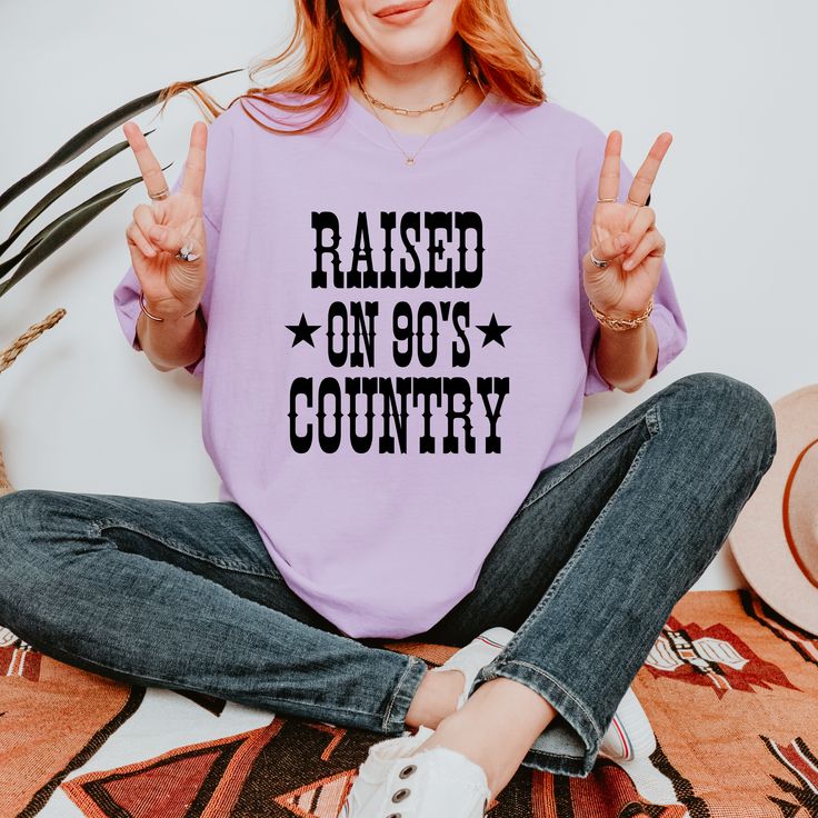 Show off your love for 90's country with this Raised on 90's Country tee. Made from 100% cotton, this unisex t-shirt is both comfortable and stylish. Get back to your roots (and your favorite music) with this must-have wardrobe addition! See the size chart below for measurements to ensure that you get the perfect fit. Current processing time is 5-10 business days Retro T-shirt For Summer Country Concerts, 90s Inspired Text Print T-shirt For Spring, 90s Style Letter Print Tops For Music Festivals, '90s Style Letter Print Tops For Music Festivals, 90s Style Tops With Letter Print For Music Festivals, 90s Letter Print Tops For Music Festivals, 90s Inspired T-shirt With Letter Print For Concert, 90s Inspired Concert T-shirt With Letter Print, Spring Crew Neck T-shirt For Country Concerts