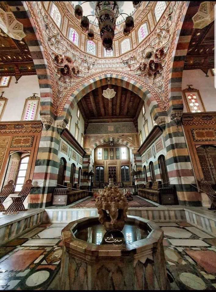 the inside of an ornate building with marble floors and walls