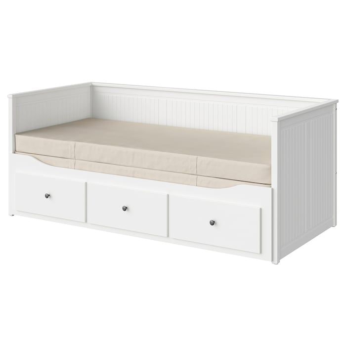 a white daybed with drawers underneath it and a pillow on the bottom shelf below