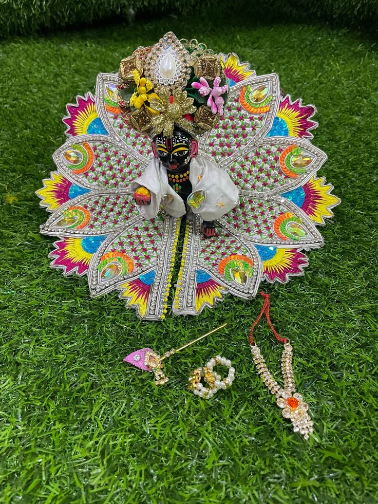 Heavy stone and Thread work laddu Gopal poshak  Available for  Size 3 - dress diameter is 7 inches Size 4 - dress diameter is 8 inches Designer piece  Quality guaranteed  From land of Krishna, Mathura With matching Pagdi , haar ( necklace), Bansi ( flute ) and kangan ( bangles) White Tikka For Puja And Navratri, White Tikka For Navratri Celebration, Multicolor Tikka With Zari Work For Festivals, White Tikka With Latkans For Puja, Multicolor Sets For Diwali Rituals, Multicolor Kundan Traditional Wear For Puja, White Kundan Set For Puja, Multicolor Tikka For Puja And Diwali, Multicolor Tikka For Puja Festivals