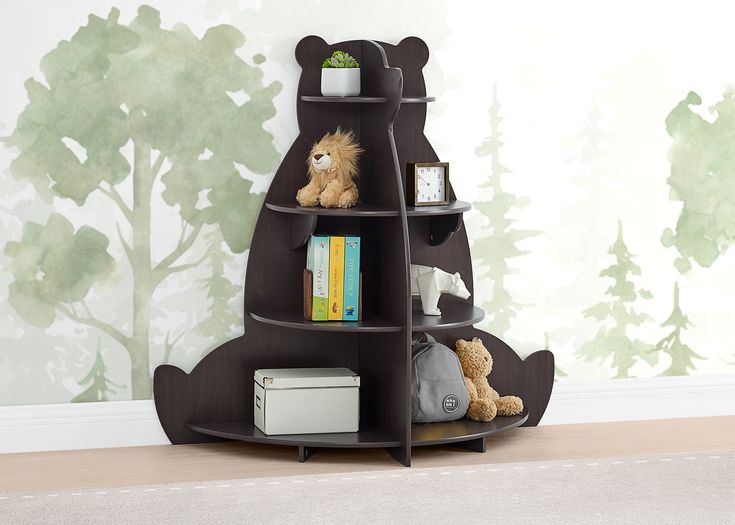 a teddy bear shelf with books and stuffed animals on it in front of a wall mural