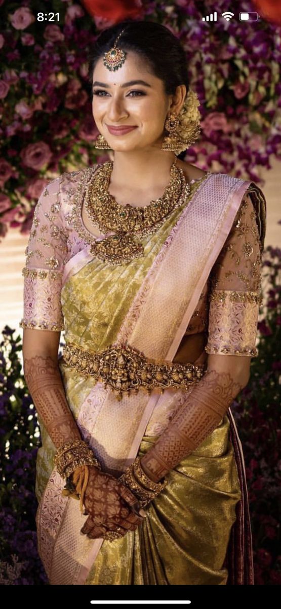 a woman in a sari posing for the camera