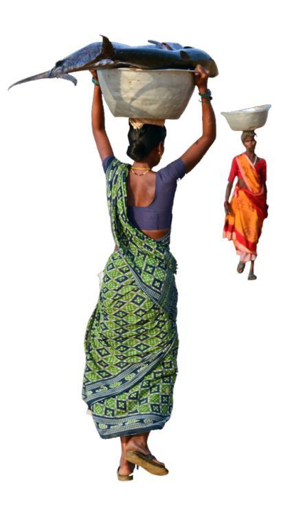 a woman carrying something on her head while walking