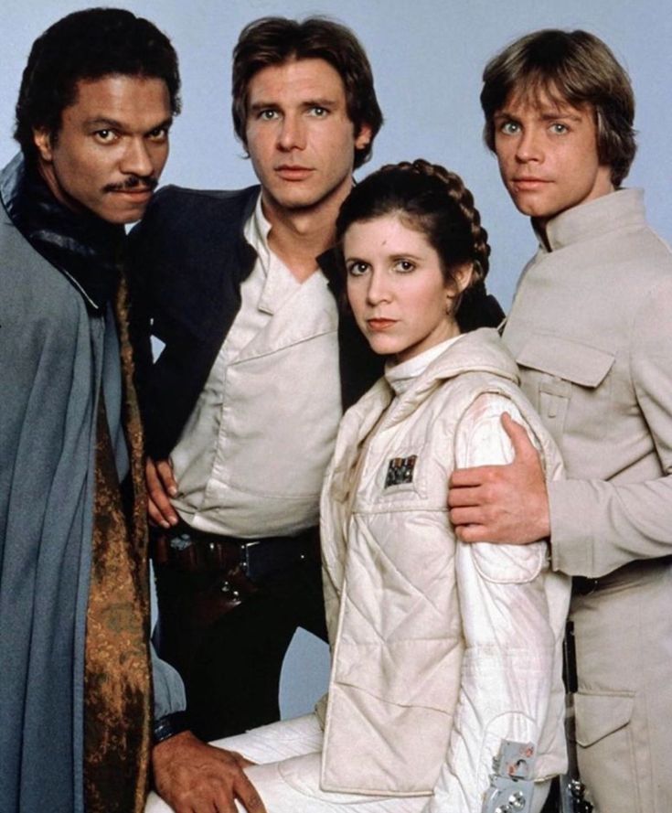 the cast of star wars posing for a photo