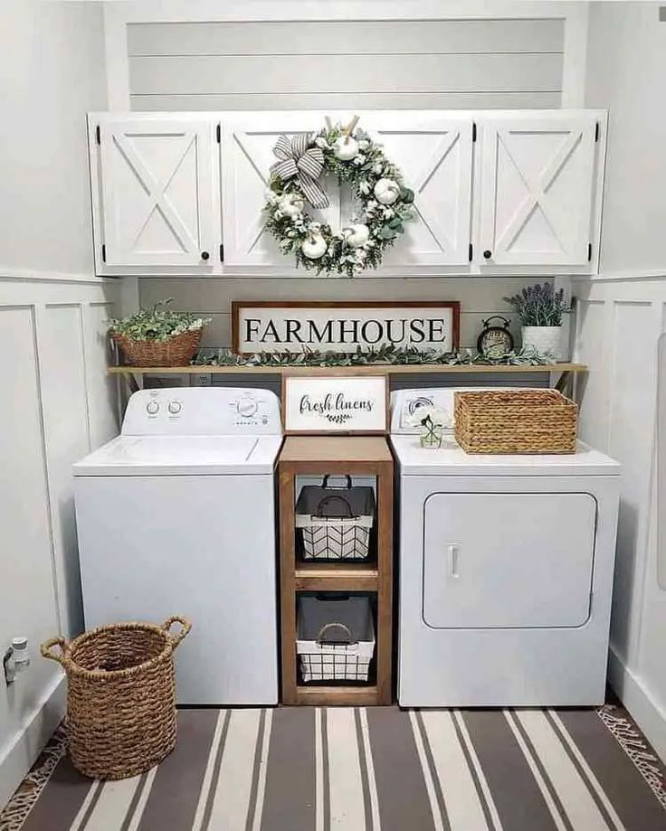 a white washer and dryer sitting in a laundry room