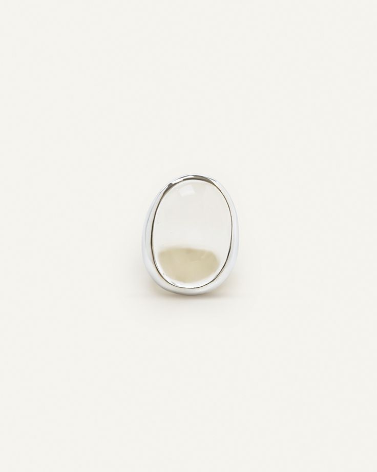 Transparent crystal quartz on a sterling silver setting. Bold yet timeless piece that can be worn for any occasion. Please handle with care since it’s a natural crystal. Coyote Negro. Untitled, 2018 White Sterling Silver Signet Ring, Elegant White Ring With Large Stone, Sterling Silver Jewelry With Si Clarity, White Sterling Silver Jewelry With Si Clarity, Sterling Silver Jewelry With Si Clarity In White, Elegant White Rings With Large Stone, Modern White Gold Crystal Ring With Gemstone, Minimalist Silver Jewelry With Large Stone, White Sterling Silver Rings With Polished Finish