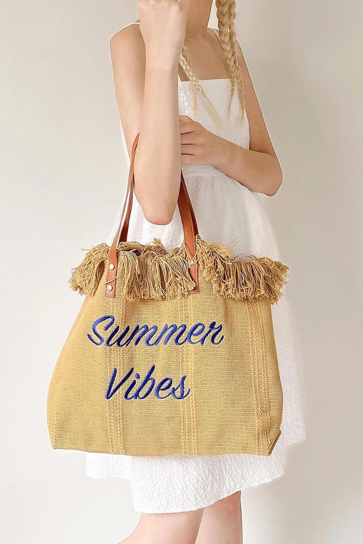 Lettering Raffia Shoulder Bag - Hand picked by storets' stylists 45cm*40cm*13cm Beige Bohemian Shoulder Bag For Shopping, Trendy Beige Beach Bag With Leather Handles, Spring Beige Shoulder Bag With Fringe, Spring Beige Fringe Shoulder Bag, Beige Fringe Shoulder Bag For Spring, Chic Beige Fringe Shoulder Bag, Beige Woven Shoulder Bag For Shopping, Brown Fringe Tote Beach Bag, Summer Shoulder Bag With Leather Handles For Shopping