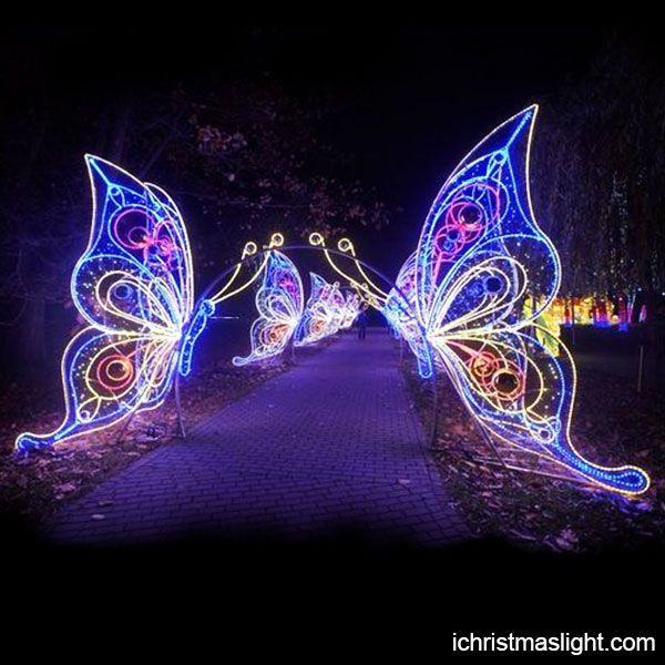 lighted butterflies on display in the park at night