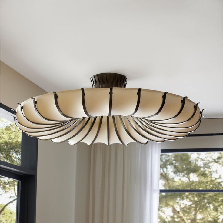 a light fixture hanging from the ceiling in a living room