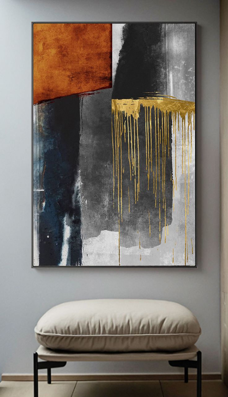 an abstract painting hangs on the wall above a bench