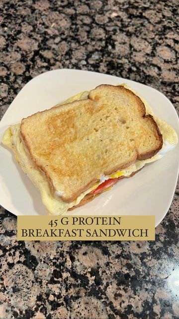 a white plate topped with a sandwich on top of a counter