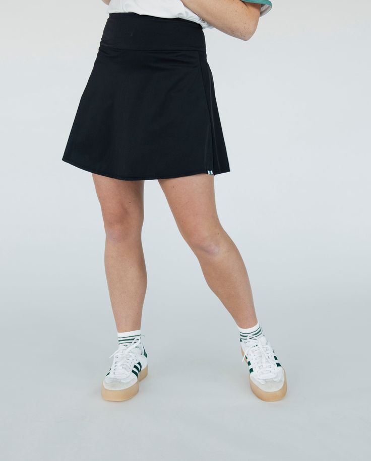 Introducing the "Linnea Skirt" - the epitome of luxury and style on the green. Crafted from our beloved "Ribbed Fore Pleasure" fabric, this skirt is designed to make a statement while ensuring comfort and performance.Featuring a high waistband, the "Linnea Skirt" not only provides a flattering silhouette but also offers support where you need it most, allowing you to move freely and with confidence throughout your game.Innovatively designed, this skirt comes with built-in shorties, complete with pockets for added convenience on the course. What sets the "Linnea" apart is its inclusion of side seam pockets, a first in our skirt collection. Now you can enjoy the convenience of easily accessible storage without compromising on style. Skirt Collection, Fun Design, Feel Confident, Trinidad And Tobago, Soft Silicone, Gq, Dress Skirt, White Shorts, White And Black