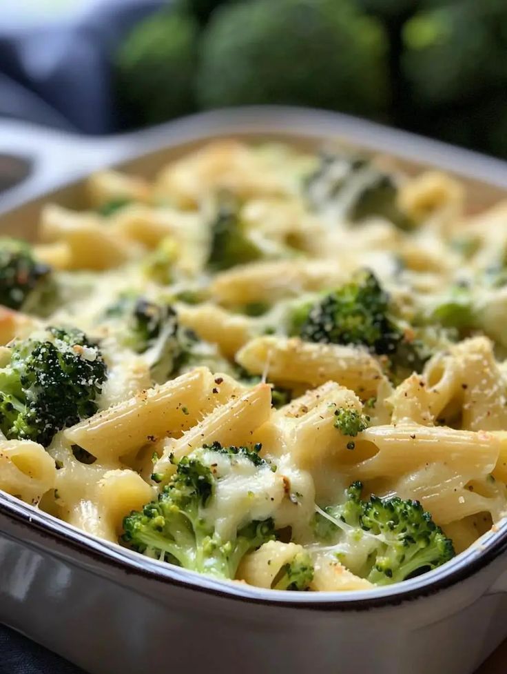 a casserole dish filled with pasta and broccoli