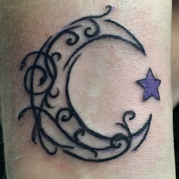 a tattoo with a crescent and stars on it