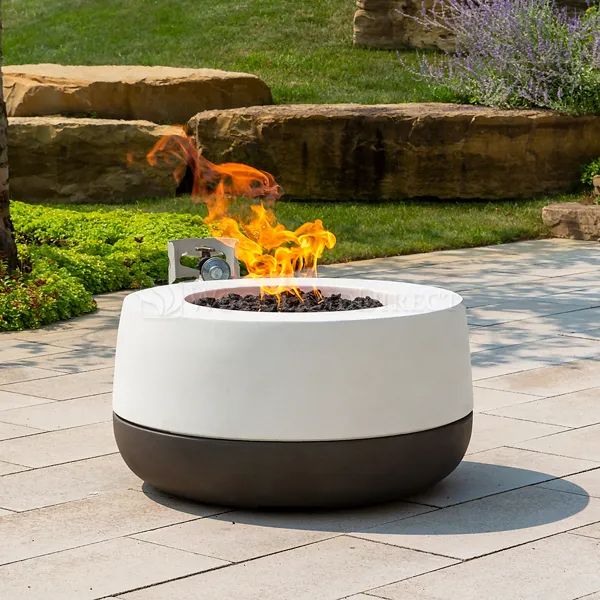 a fire pit sitting on top of a brick patio