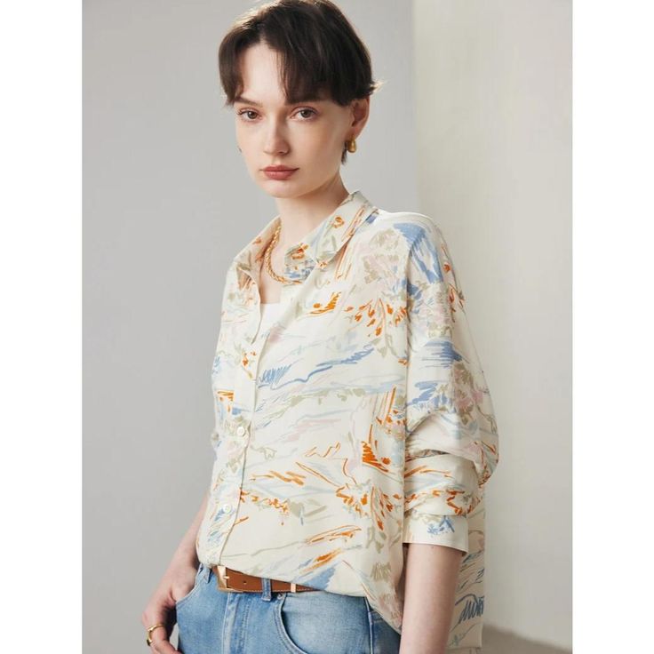 Embrace effortless elegance with our Chic Summer Silk Blouse, designed specifically for the sophisticated woman who appreciates style and comfort. Crafted from luxurious 100% Mulberry silk, this blouse combines a timeless print with a casual yet refined silhouette, perfect for office wear or elevating your everyday look. Product Features Fabric: Made from 100% high-quality Mulberry silk, ensuring a smooth and soft feel against your skin. Design: Features a vibrant print that adds a touch of flair to any outfit, making it an eye-catching piece in your wardrobe. Fit: Loose fit design provides comfort and breathability, ideal for the warmer months of spring and summer. Collar: Stylish turn-down collar that offers a chic, polished look. Closure: Single-breasted closure allows for easy wearing Casual Beige Blouse For Office Wear, Elegant Printed Summer Shirt, Casual Silk Shirt With Relaxed Fit, Modern Silk Tops For Fall, Modern Long Sleeve Silk Blouse, Modern Office Shirt For Spring, Summer Silk Office Shirt, Elegant Floral Print Blouse With Relaxed Fit, Summer Office Printed Shirt