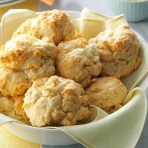 a bowl filled with biscuits on top of a table