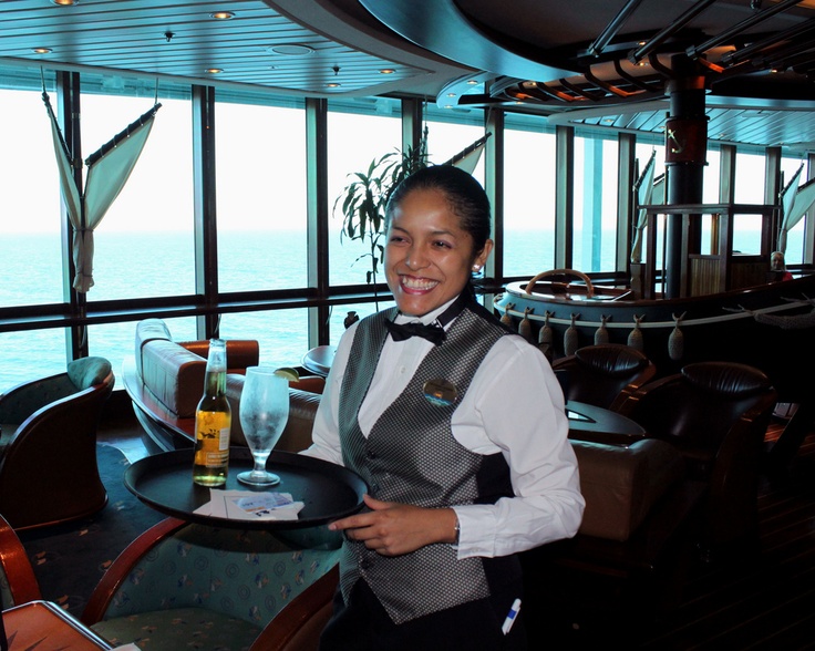 a waitress holding a tray with drinks on it