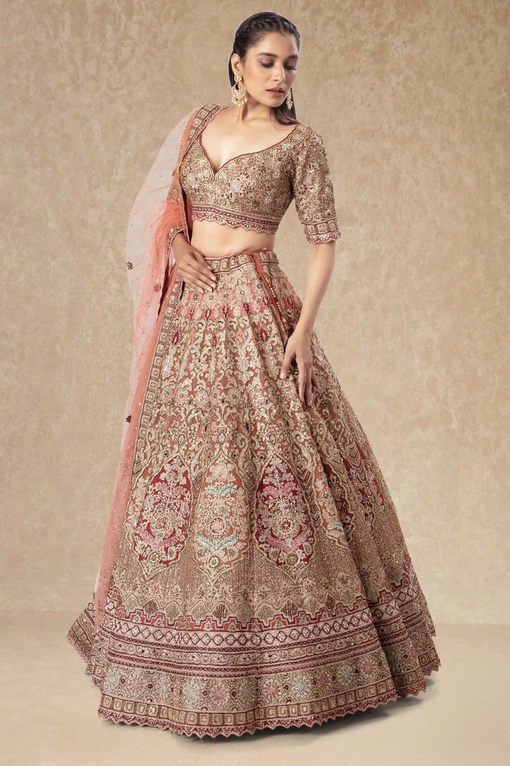 "This Bridal Lehenga BL-217 features intricate sequence and bead work, adding a touch of glamour to any bride's wedding day ensemble. With its delicate detailing and high-quality craftsmanship, this lehenga is sure to make any bride feel like a true princess on her special day. Make your wedding dreams a reality with the Bridal Lehenga BL-152." WASH CARE INSTRUCTIONS - Please Dry clean only when it is applicable! Ready to Ship! Saree-shape Wedding Gown With Intricate Embroidery, Traditional Raw Silk Wedding Gown, Floor-length Hand Embellished Sharara For Wedding, Hand Embellished Floor-length Sharara For Wedding, Floor-length Hand Embellished Wedding Sharara, Bollywood Semi-stitched Wedding Dress, Elegant Wedding Dress With Resham Embroidery For Festive Occasion, Elegant Traditional Drape Wedding Dress For Festive Occasion, Elegant Traditional Drape Wedding Dress For Reception