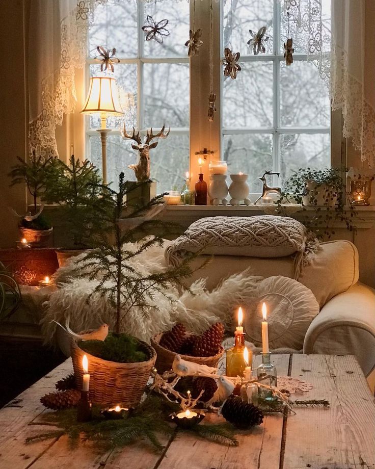 a living room filled with lots of furniture and christmas decorations on top of a wooden table