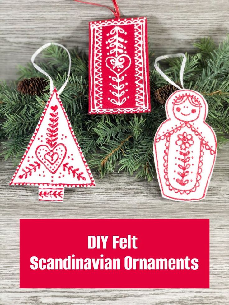 two christmas ornaments hanging from a tree with the words diy felt scandinavian ornaments