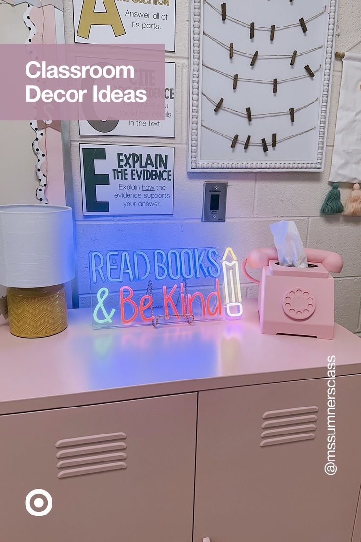 a pink school locker with a neon sign reading read books and be kind