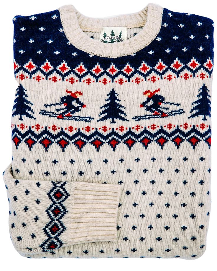 a white sweater with blue and red designs on it