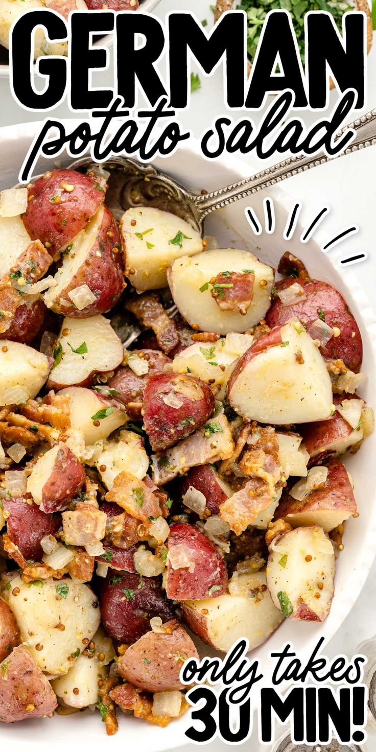 a white bowl filled with potatoes and meat on top of a table next to a fork