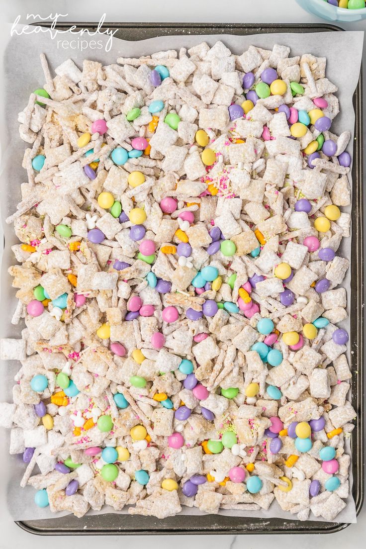 a tray filled with lots of candy and marshmallows on top of it