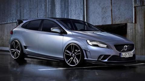 a silver volvo car parked in front of a building on a wet parking lot at night