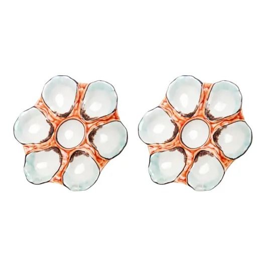 two pairs of white and copper flower shaped earrings, one with clear stones on it