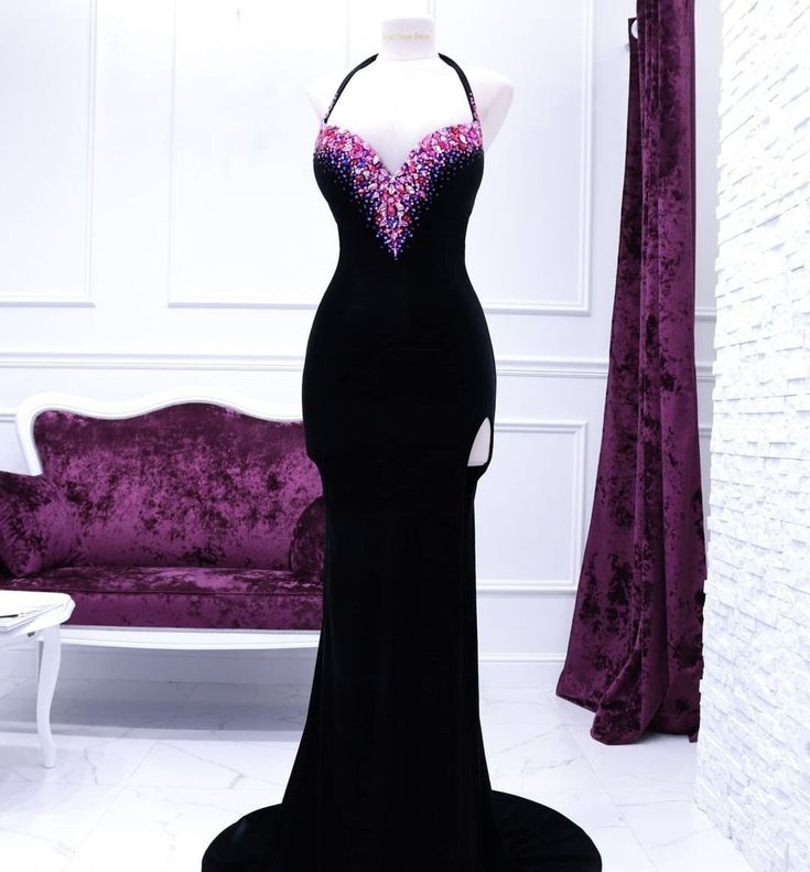 Indulge in the captivating elegance of this dress, expertly tailored from rich, noble black velvet that lends an air of opulence. The décolletage is a mesmerizing display of grandeur, adorned with lavish, luminous rhinestones that command attention and illuminate the neckline. Fit for a queen's presence, this gown combines luxurious fabric, meticulous detailing, and a regal aura. Production time excluding delivery: finished design - 4-5 weeks; custom design 2-3 months. -------------------------- Velvet Gala Dress With Fitted Bodice, Velvet Dress With Fitted Bodice For Gala, Fitted Bodice Velvet Dress For Gala, Glamorous Velvet Evening Dress With Fitted Bodice, Luxury Velvet Prom Evening Dress, Luxury Fitted Velvet Evening Dress, Glamorous Velvet Evening Gown, Glamorous Fitted Velvet Gown, Fitted Glamorous Velvet Gown