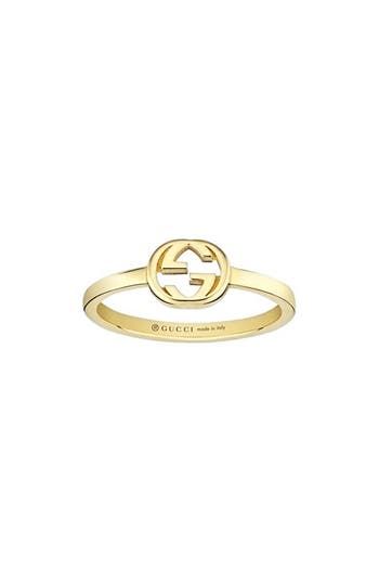 The recognizable GG-logo centers this 18-karat-gold ring that's perfect for stacking. 1/4" pendent; 1/8" band 18k gold Made in Italy Gucci Ring Gold, Classic Gucci Engraved White Gold Ring, Classic Gold Jewelry With Logo, Classic Gucci Engraved Ring For Anniversary, Classic Gucci Engraved Ring As Gift, Classic Gucci Engraved Ring For Gift, Gucci White Gold Ring In Fine Jewelry Style, Gucci Fine Jewelry White Gold Rings, Gucci White Gold Fine Jewelry Ring