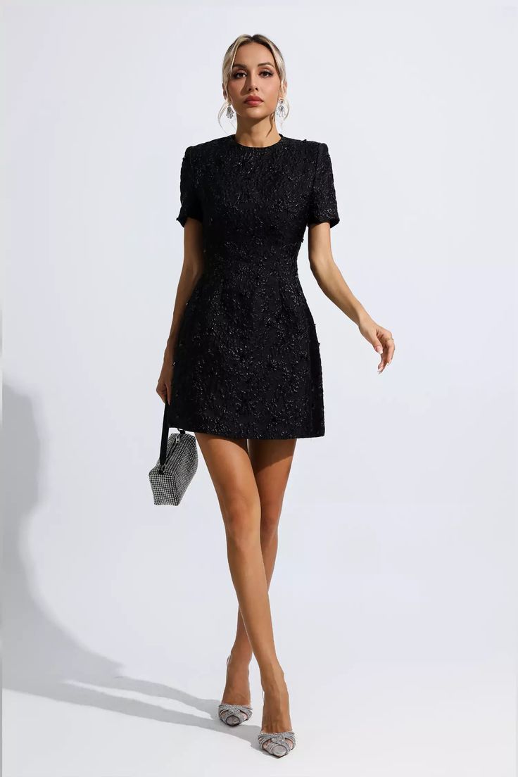 Astrid Black Jacquard Floral Mini Dress is the perfect choice for chic and elegant looks. Crafted from luxuriously soft jacquard fabric, the short mini sleeves and skirt create an effortlessly chic look, while the floral design adds a classic touch to this dress. It's trimmed with dainty sequins for a unique touch.  Dress Length: Approx 78cm Materials: Polyester Gentle Dry Clean Only  Model is 5 ft 7 and wears size S  Colour may vary due to lighting on images. The product images (without model) Vintage Floral Top, Summer Swag, Bandage Midi Dress, Looks Party, Chic And Elegant, Estilo Chic, Puff Sleeve Dresses, Ruched Dress, Jacquard Fabric